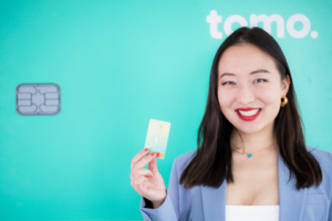 CEO Kristy Kim with Tomo card